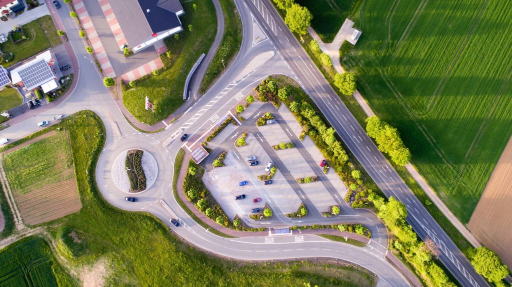 Drone view of the parking lot by the roundabout