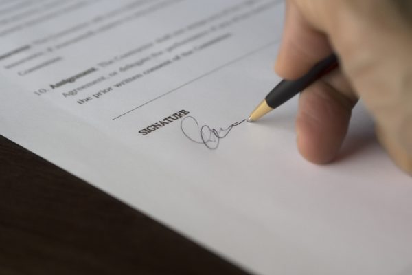 agreement signature business close up